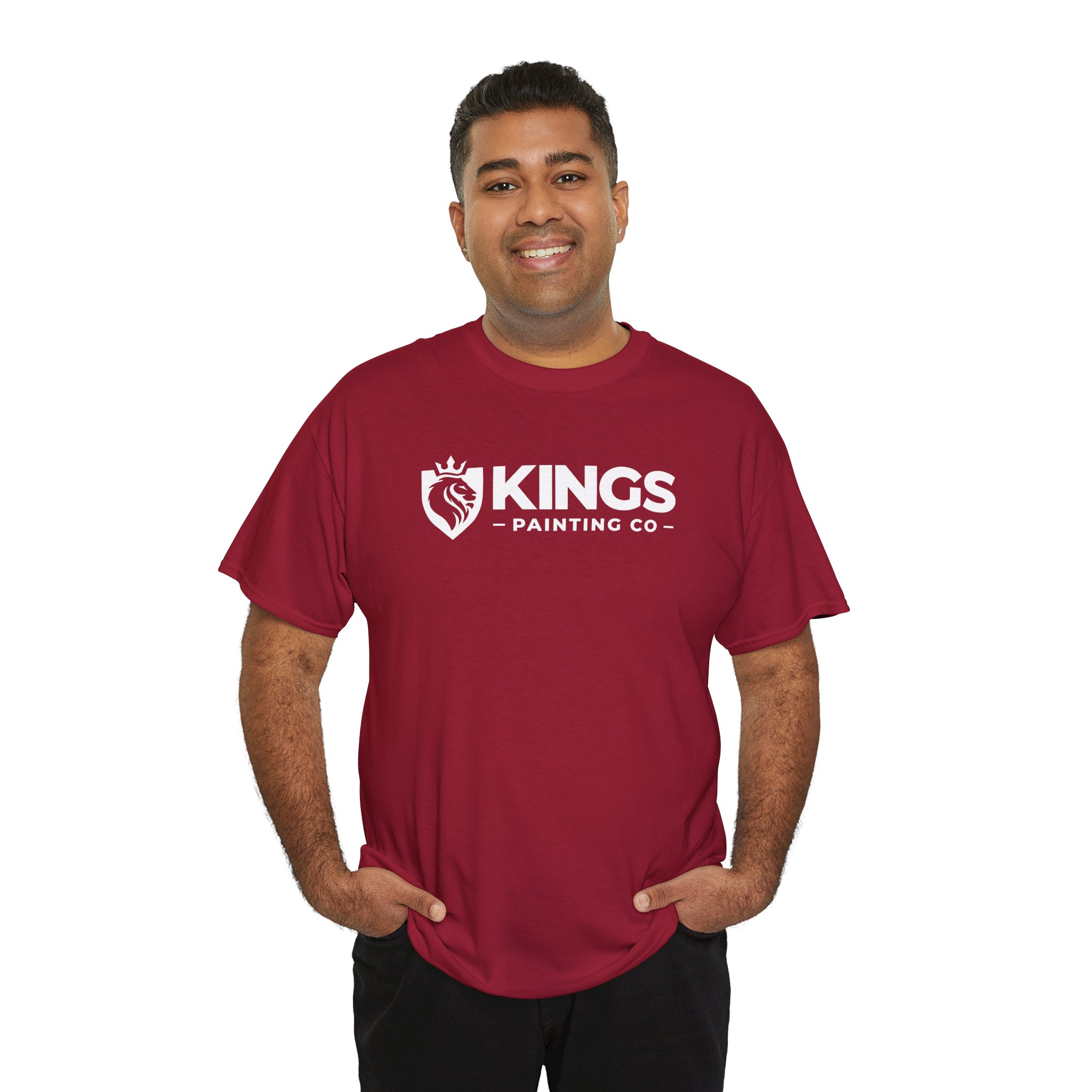 A smiling person stands with hands in pockets against a white background, wearing the Kings Painting Co. Logo T‑Shirt (Classic) | Gildan Ultra Cotton (G5000) in maroon.