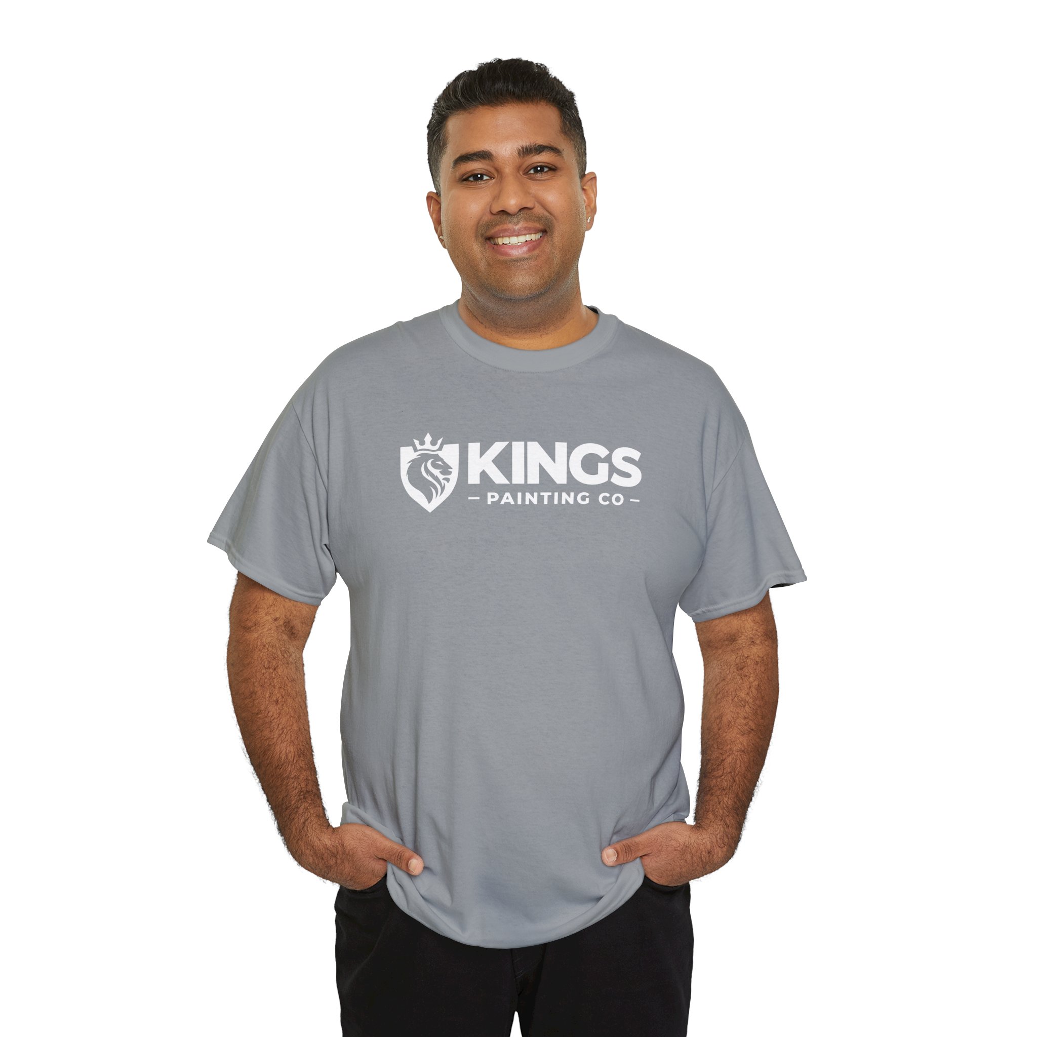 A man stands smiling with his hands in his pockets against a plain white background, wearing the Kings Painting Co. Logo T‑Shirt (Classic) | Gildan Ultra Cotton (G5000) in gray.