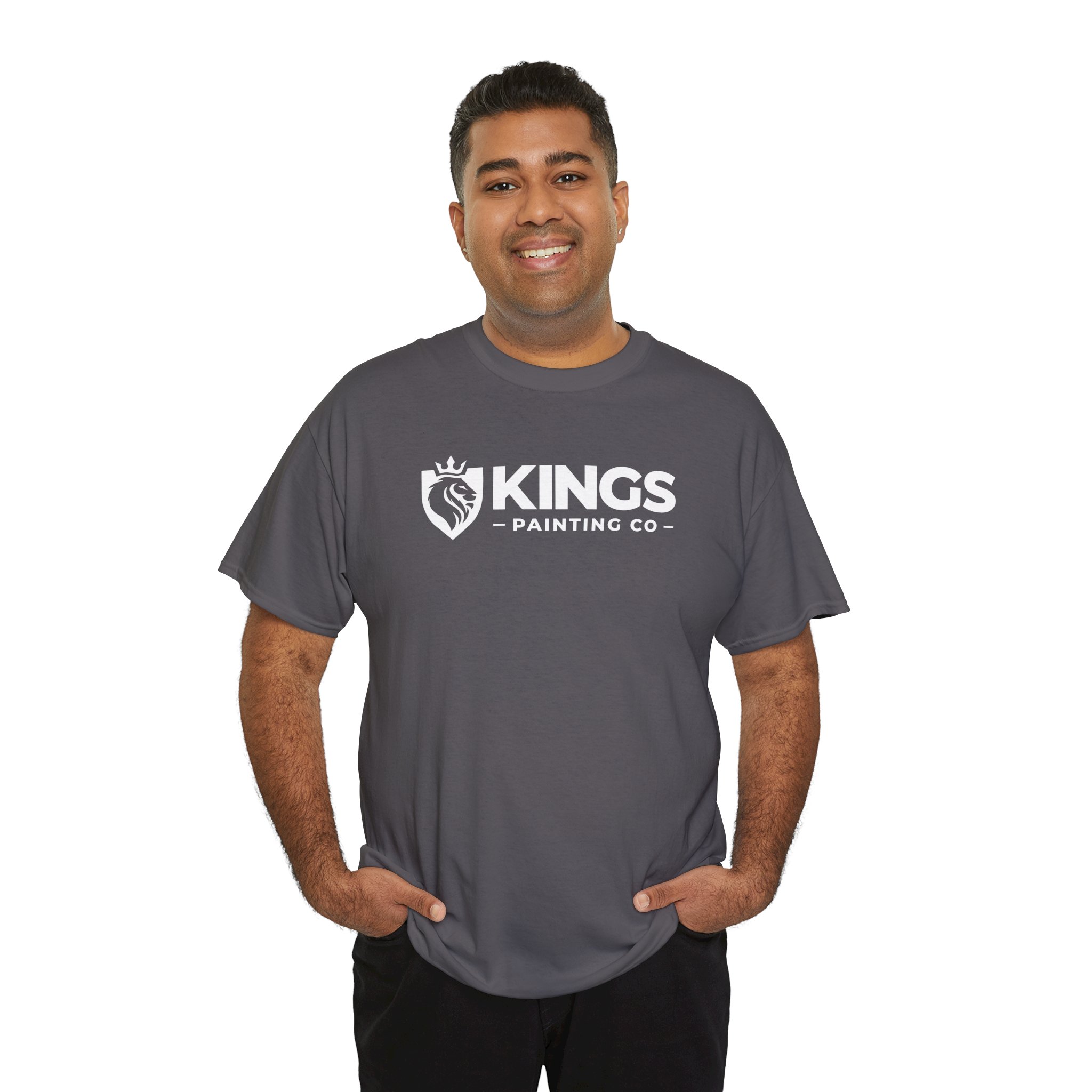 A smiling man stands with his hands in his pockets against a white background, wearing the classic Kings Painting Co. Logo T-Shirt (Gildan Ultra Cotton G5000) in gray.