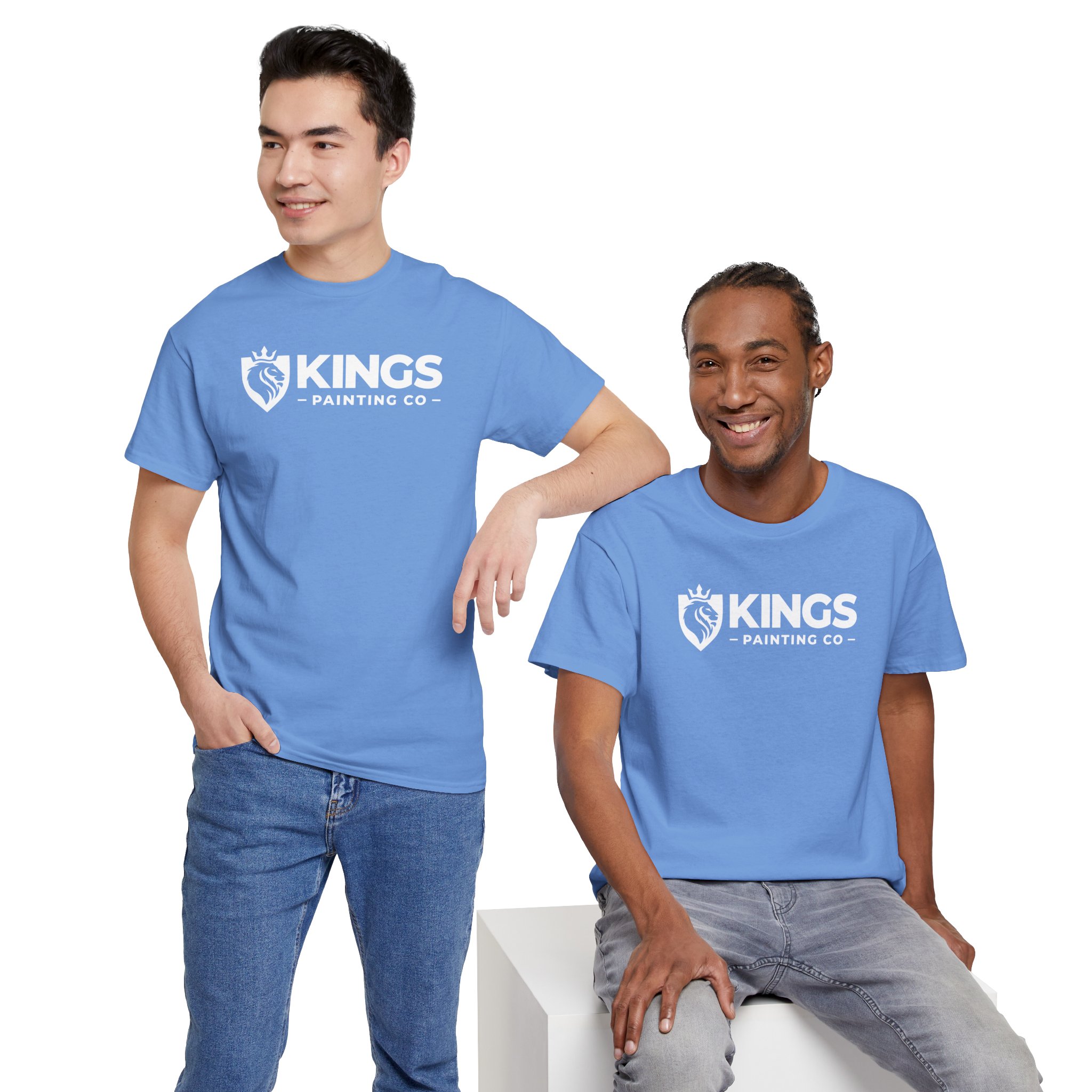 Two men wearing Kings Painting Co. Logo T‑Shirts (Classic) | Gildan Ultra Cotton (G5000) in light blue pose against a white background; one stands with a hand in his pocket, while the other sits—both smiling.